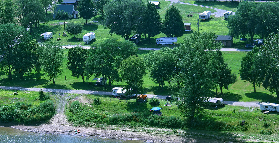 RV Site with Family sitting outside
