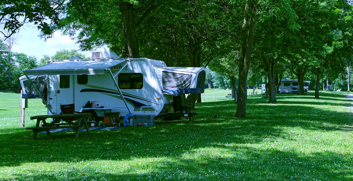 RV Site with Family sitting outside